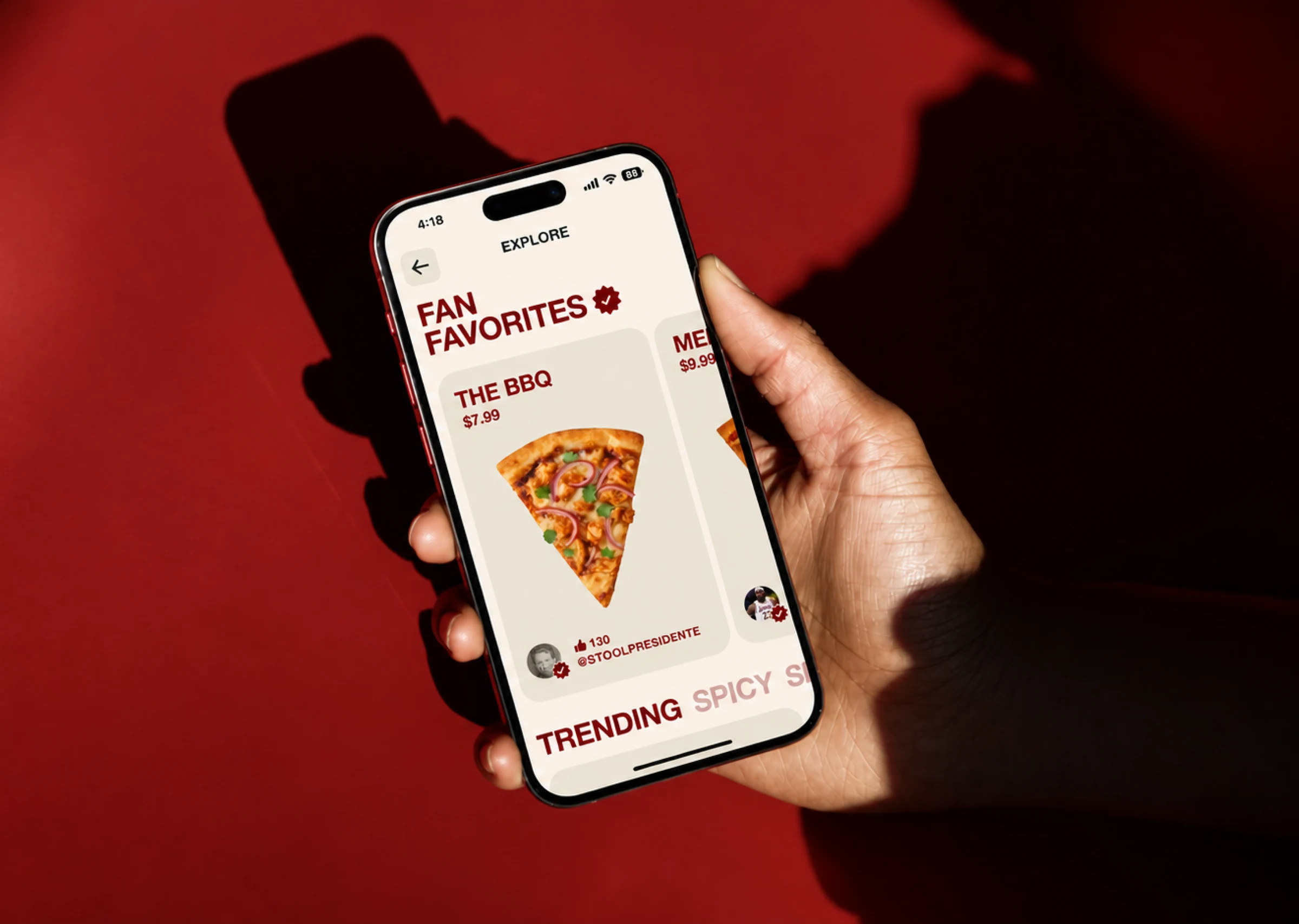 A hand holding a phone showing the MySlice pizza menu.